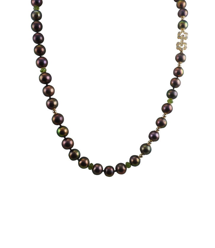 Black pearl necklace peridot as colored accent. Designer pearl jewelry
