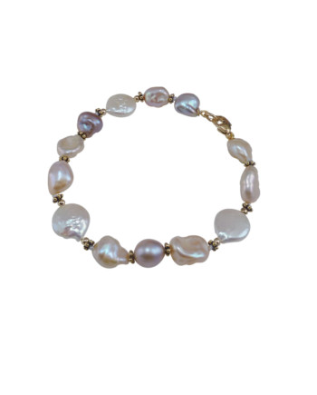 Delicate keshi pearl bracelet features features keshi pearls of various colors. Designed and created by Jewelry Olga Montreal Canada