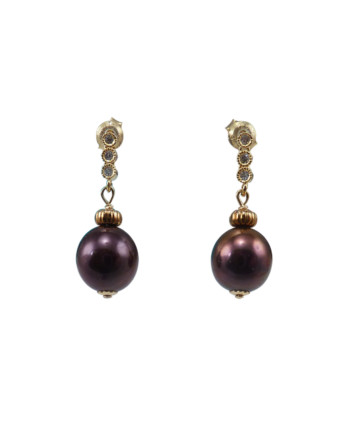 Elegant pearl earrings oval pearls. Modern designer pearl jewelry designed and created in Montreal Canada
