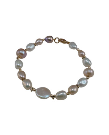 Delicate pearl bracelet coin pearl as accent. Modern designer pearl jewelry by Jewelry Olga Montreal Canada