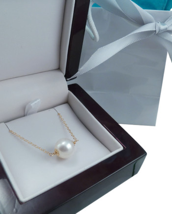 Station white pearl necklace with a large white pearl. Designed and created by Jewelry Olga Montreal Canada