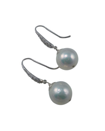 Stylish dangling white pearl earrings. Pearl jewelry designed and created in Montreal, Canada
