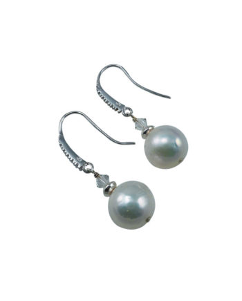 Modern dangling white pearl earrings. Designed and created by Jewelry Olga Montreal Canada